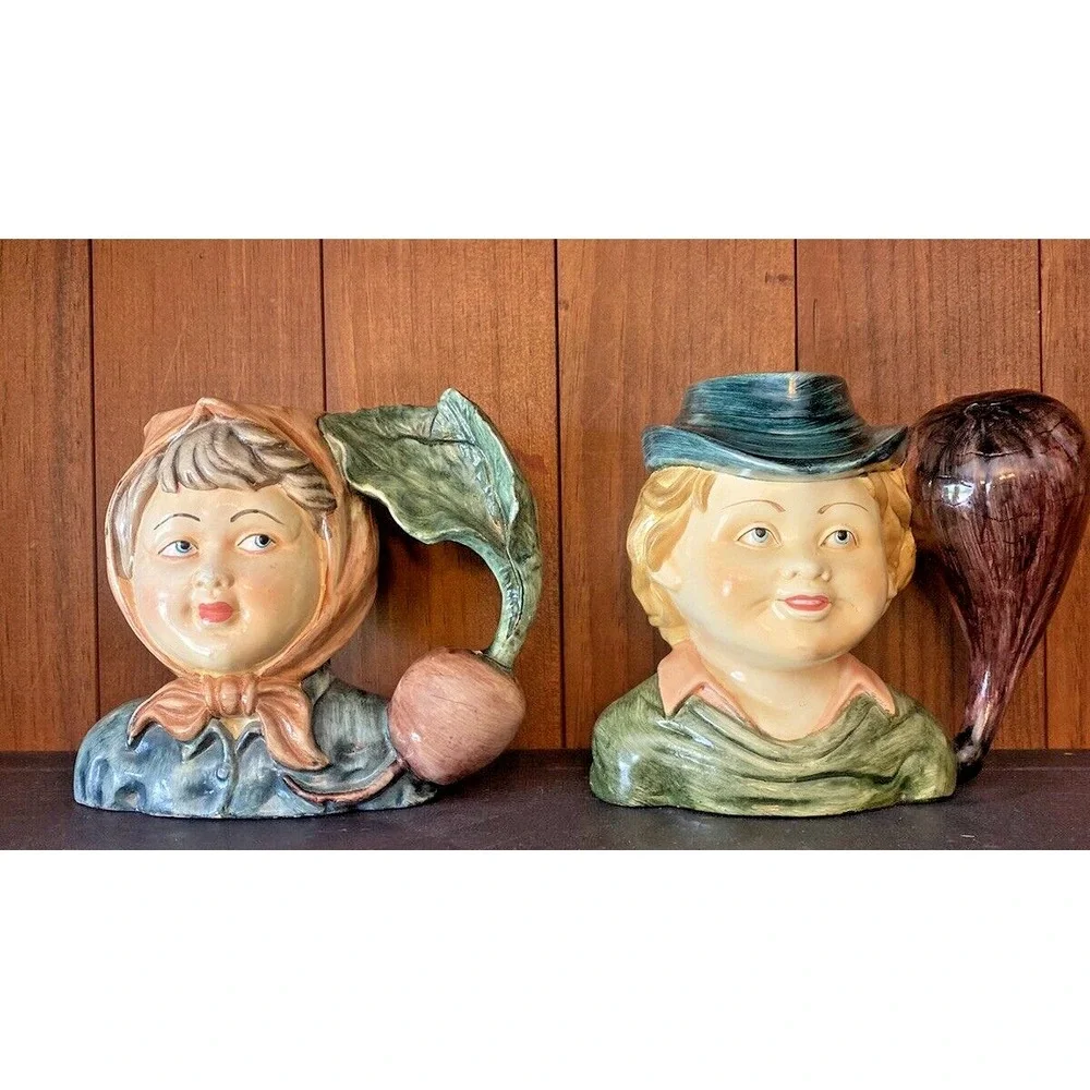 2 Vintage Jug Head Figural Girl Boy Vase Mug w/vegetable Radish Eggplant handle